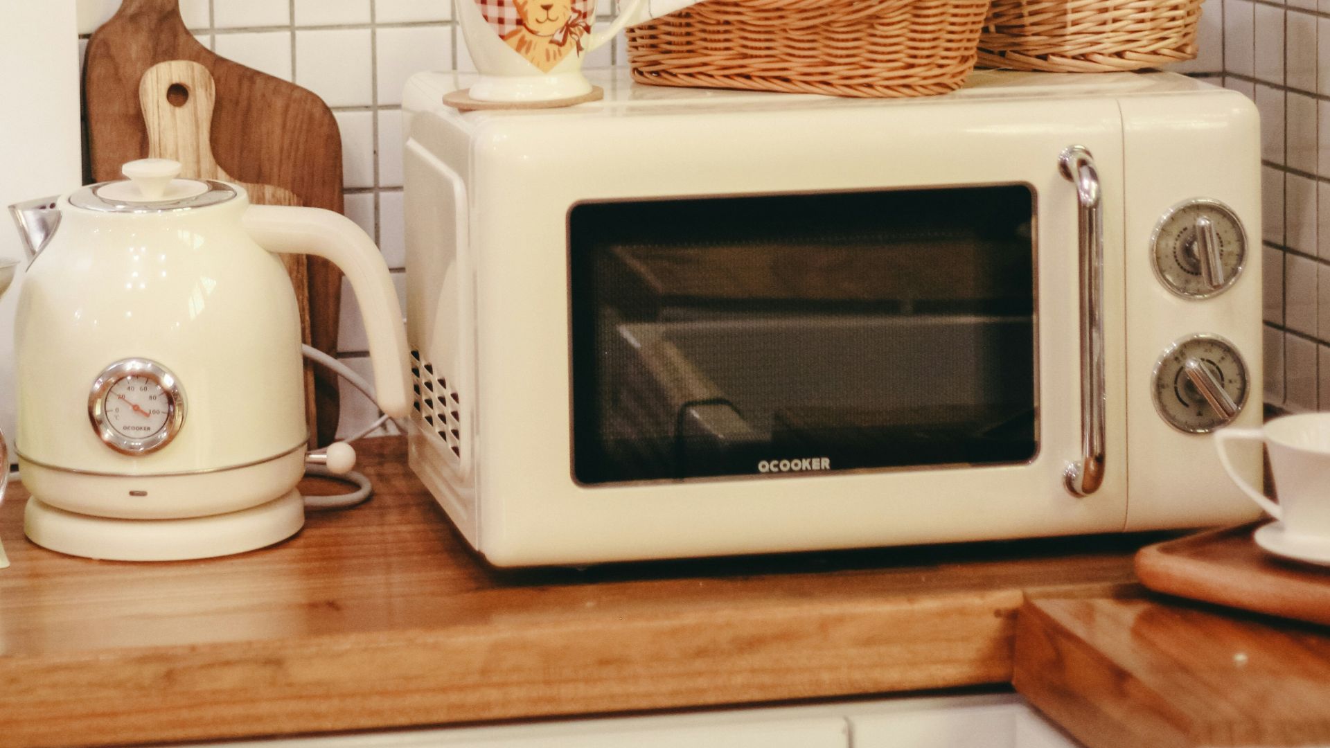 a white microwave oven sitting on top of a wooden counter