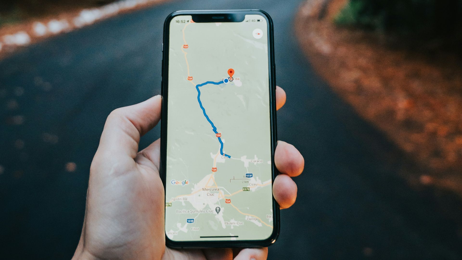 person holding white iphone 5 c