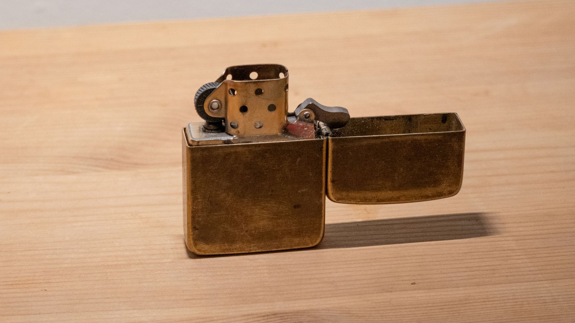 a couple of lighters sitting on top of a wooden table