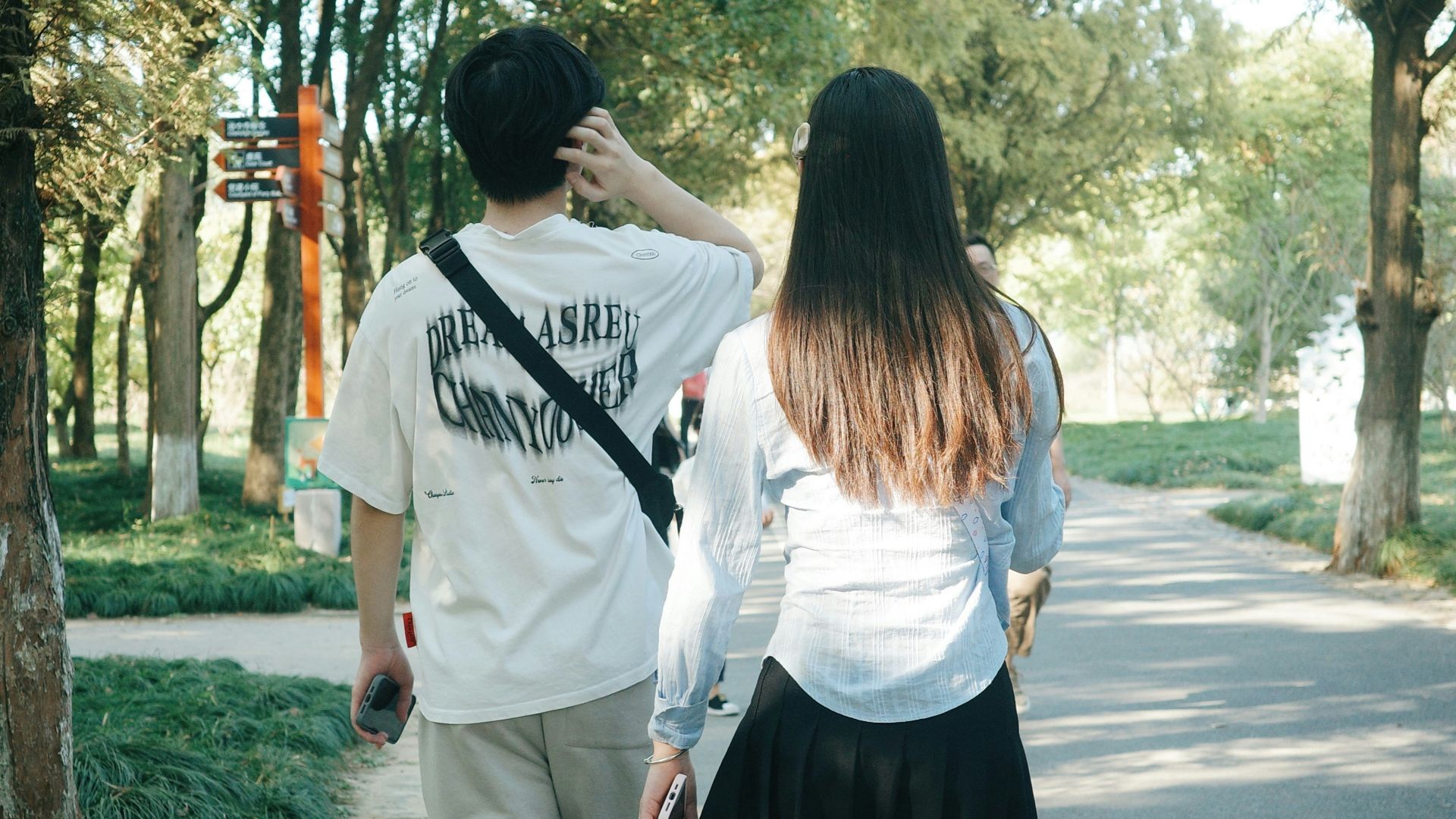 a man and a woman walking down a street