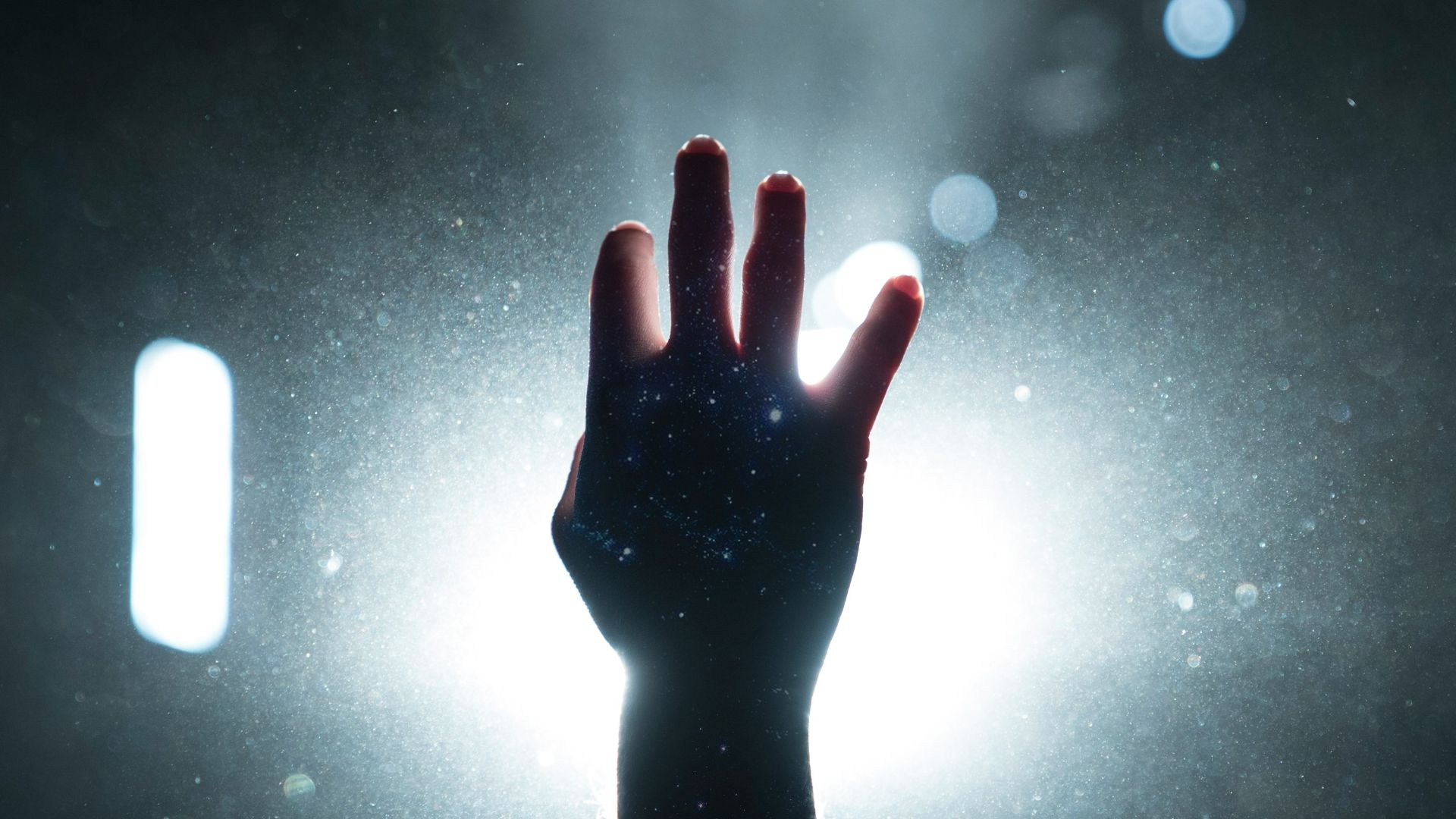 person's hand on light