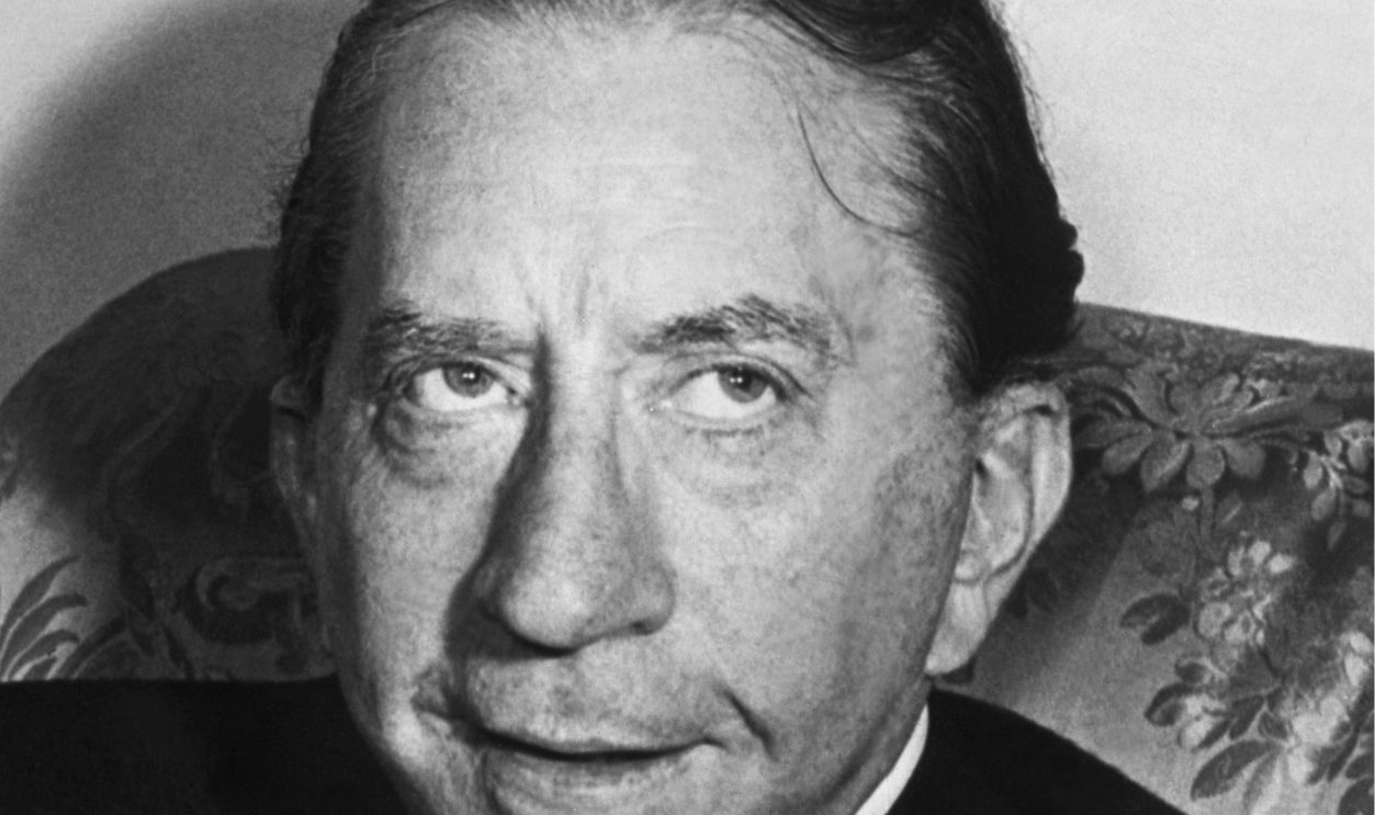 Multi-millionaire, J. Paul Getty, drinks a glass of milk, his favorite beverage, during a trip to London. Photograph 1957.