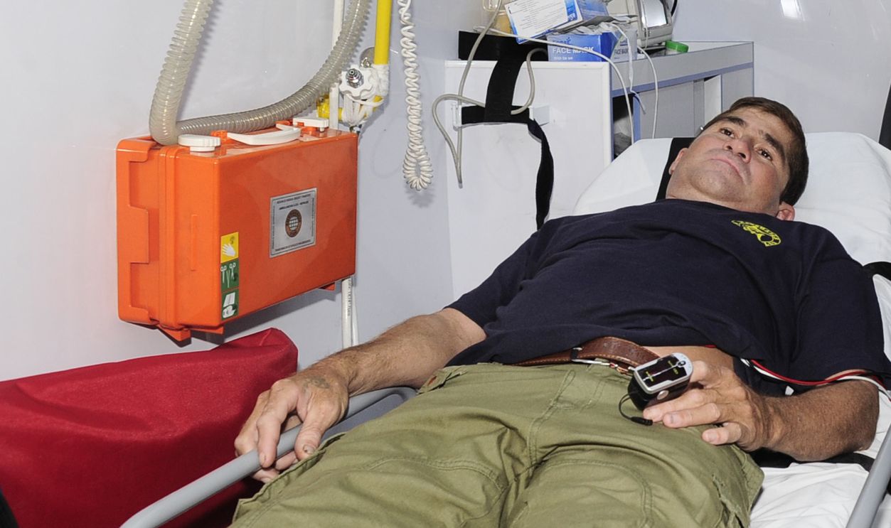 Gettyimages - 468845933, EL SALVADOR-CASTAWAY-SURVIVAL-ALVARENGA Salvadorean castaway Jose Salvador Alvarenga remains in an ambulance on his way to San Rafael hospital in Santa Tecla, El Salvador on February 11, 2014. The Salvadoran castaway who says he spent 13 months adrift in the Pacific arrived home Tuesday to the warm embrace of a family that thought him dead. Alvarenga traveled across the ocean by plane this time, two weeks after the fisherman washed ashore in the Marshall Islands, telling the world he had floated for 12,500 kilometers (8,000 miles) in a small boat. AFP PHOTO / Rene Quintanilla