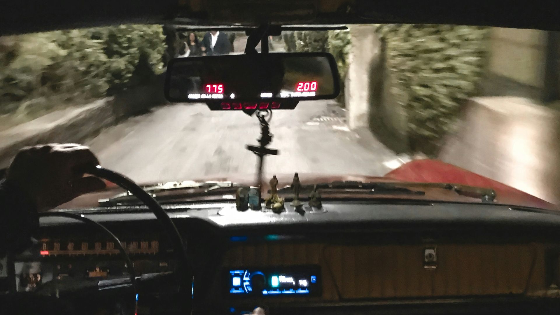 man driving classic car