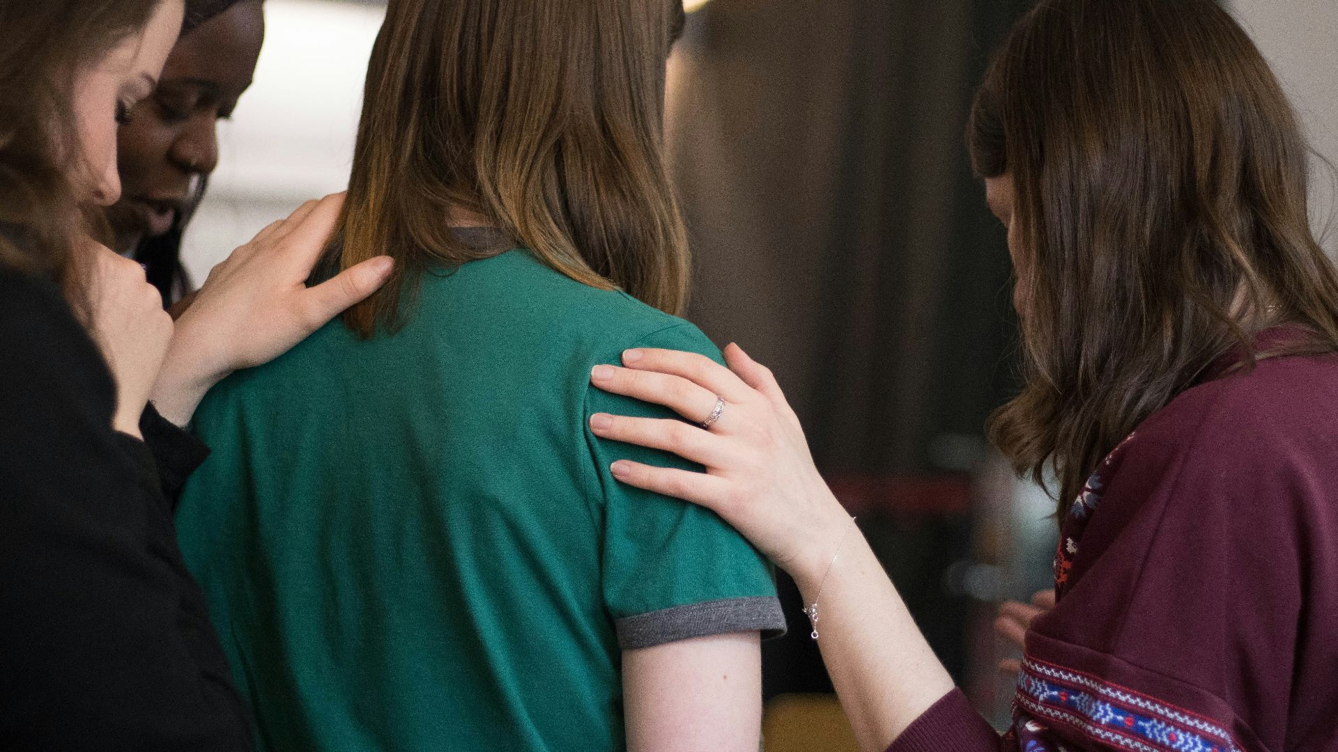 four women looking down