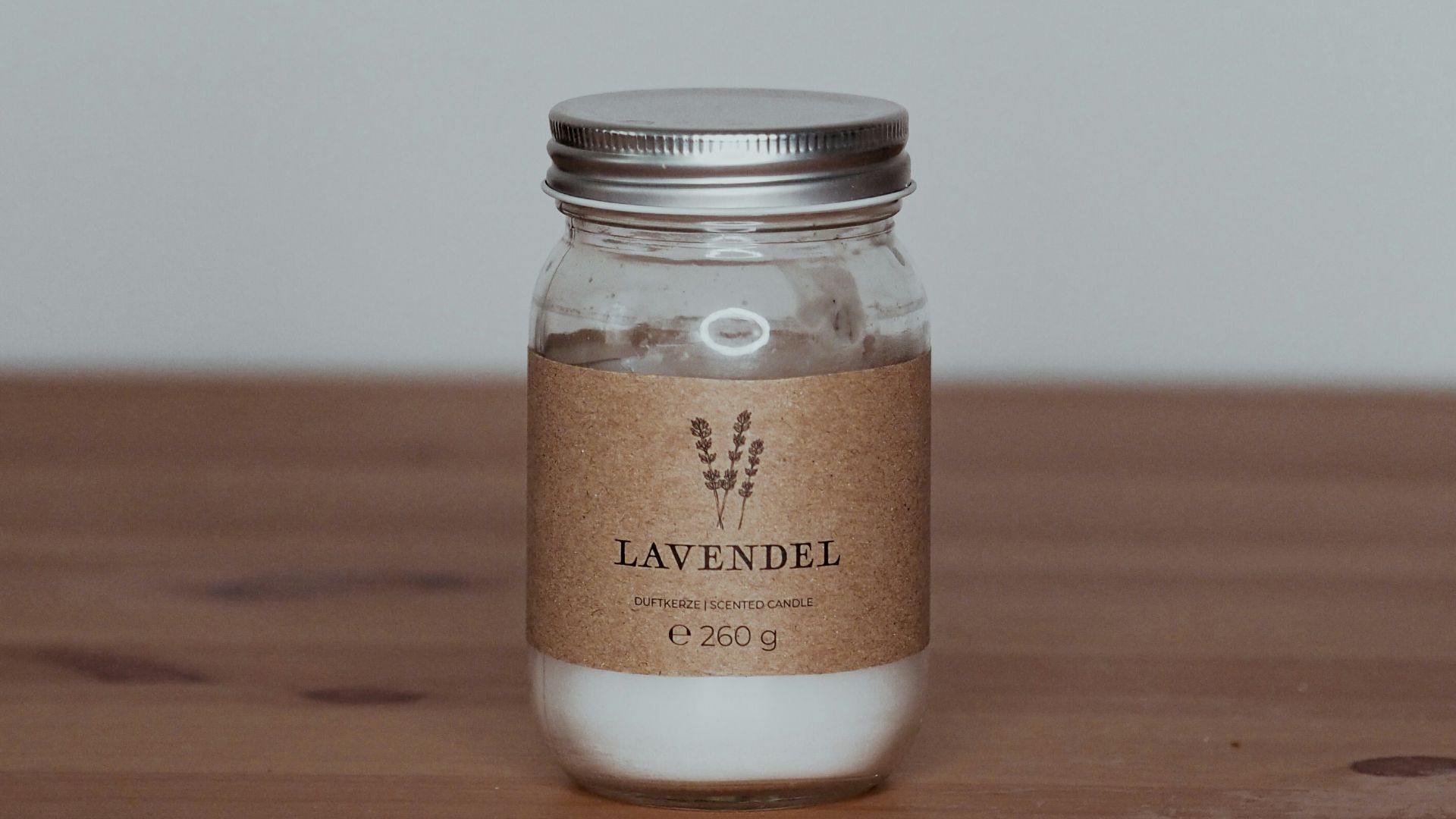 a glass jar with a label on it sitting on a table