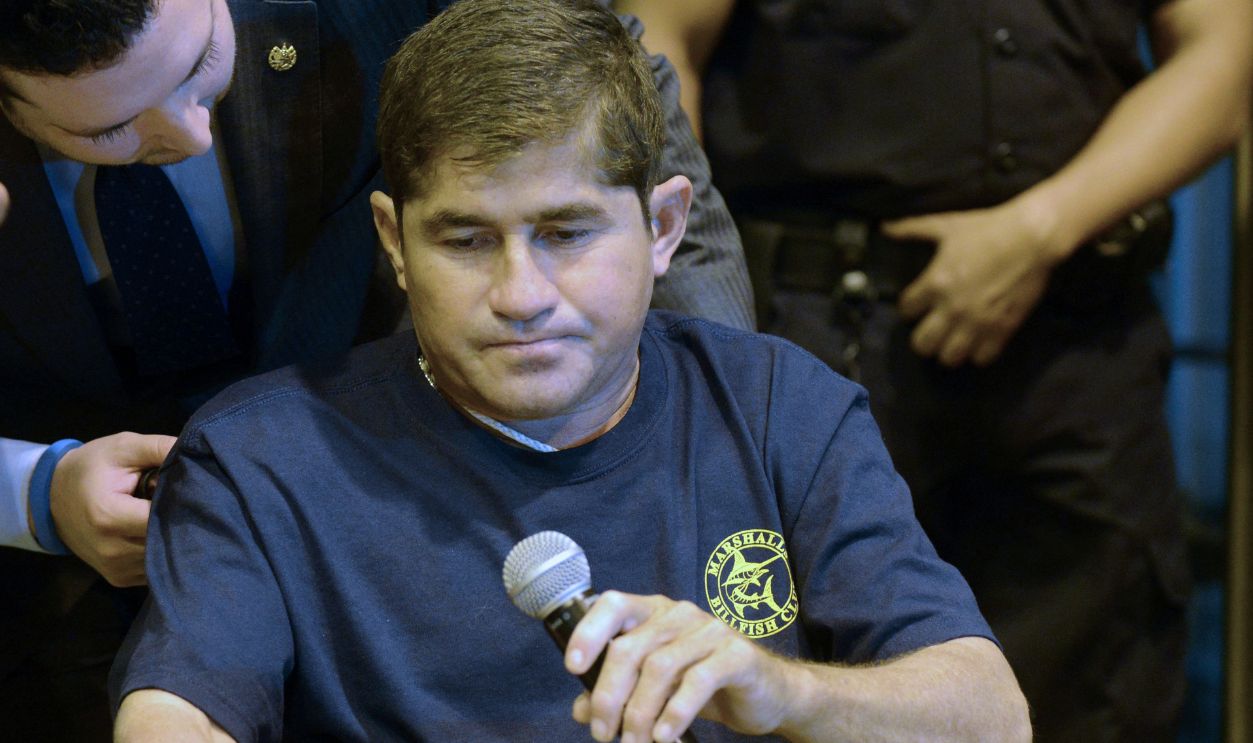 Gettyimages - 468823005, EL SALVADOR-SURVIVAL-ALVARENGA Salvadorean castaway Jose Salvador Alvarenga holds a microphone upon his arrival to El Salvador international airport in San Luis Talpa, 50 km south of San Salvador on February 11, 2014. The Salvadoran castaway who says he spent 13 months adrift in the Pacific arrived home Tuesday to the warm embrace of a family that thought him dead. Alvarenga traveled across the ocean by plane this time, two weeks after the fisherman washed ashore in the Marshall Islands, telling the world he had floated for 12,500 kilometers (8,000 miles) in a small boat. AFP PHOTO / Johan Ordonez