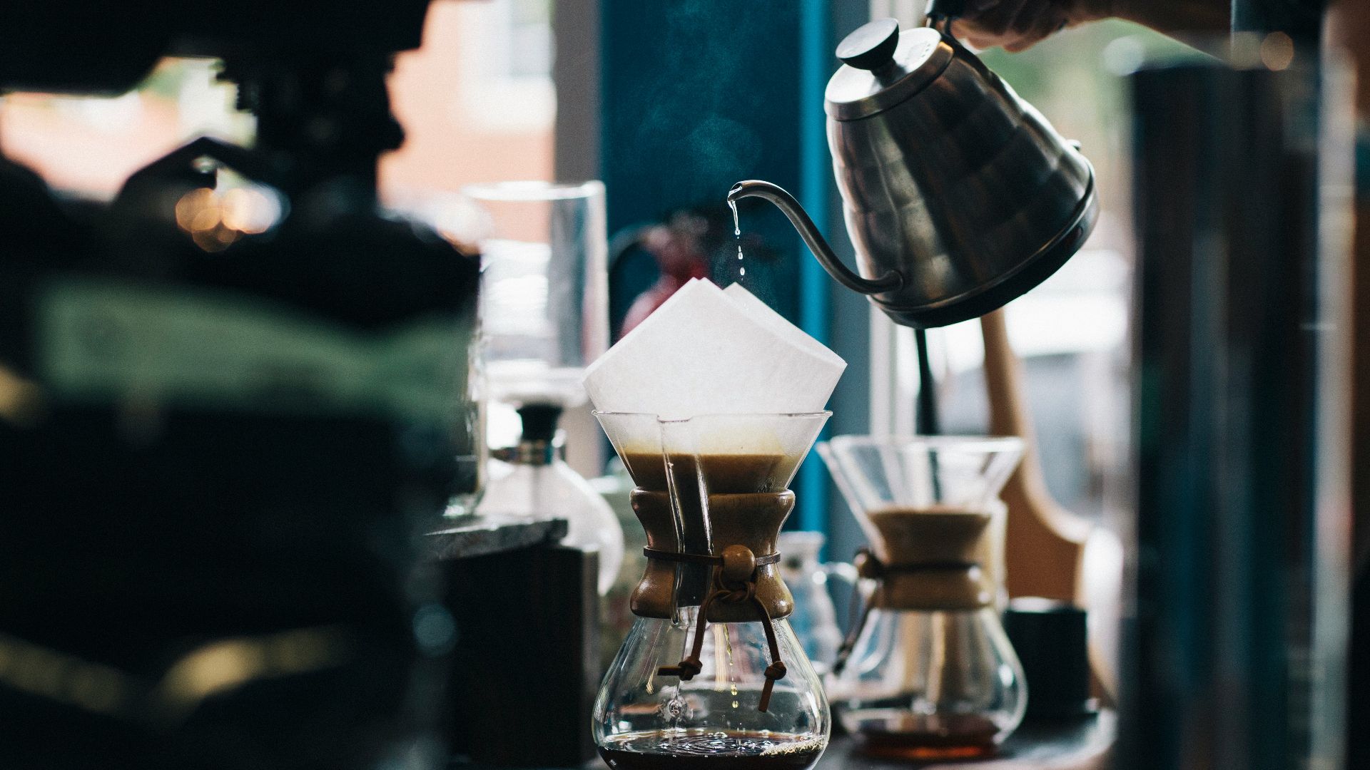 person filling glass container