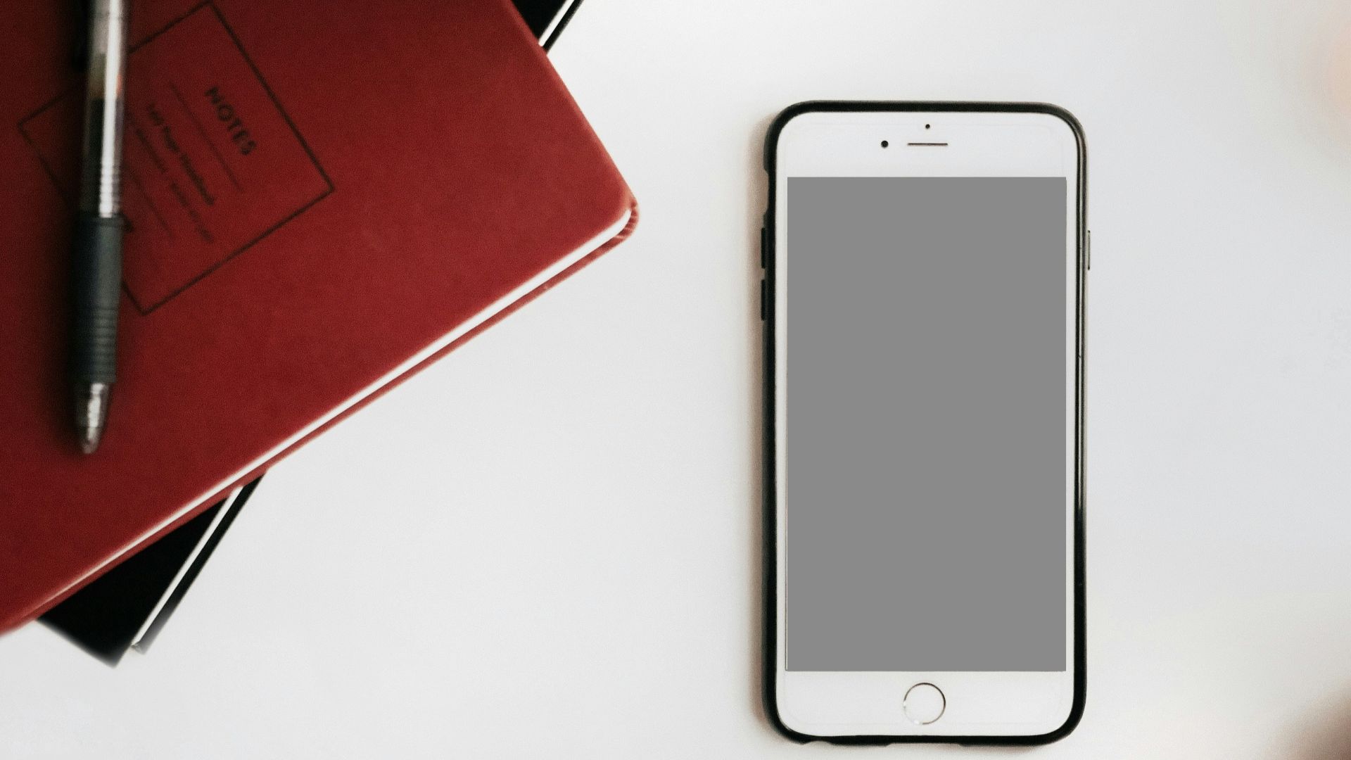 photo of iPhone on white surface