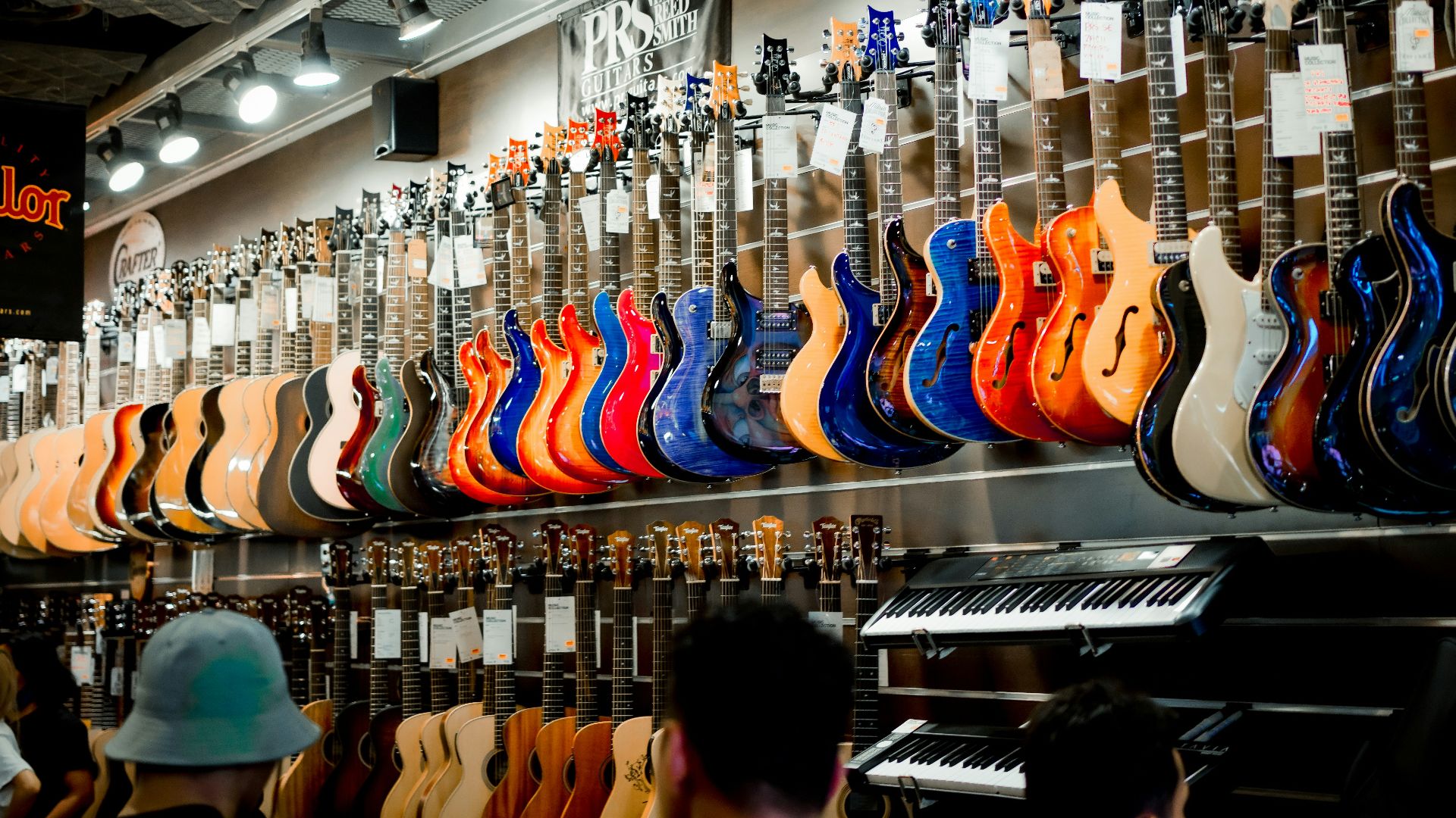a guitar shop with a variety of guitars on display