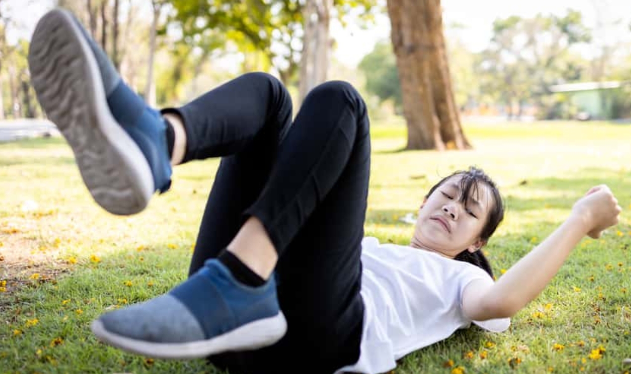 Asian Child Girl Falling Down - Shutterstock 1686593590