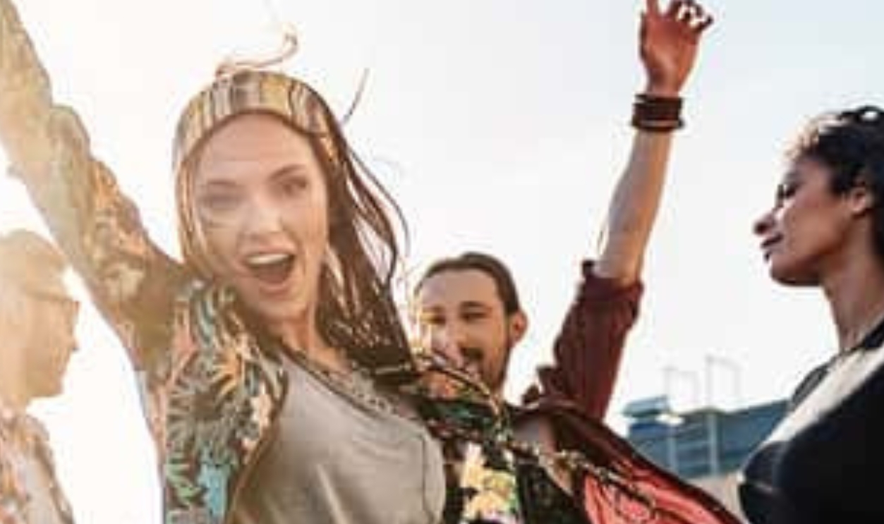 Carefree Girl Enjoying Party On Rooftop -Shutterstock 653398699