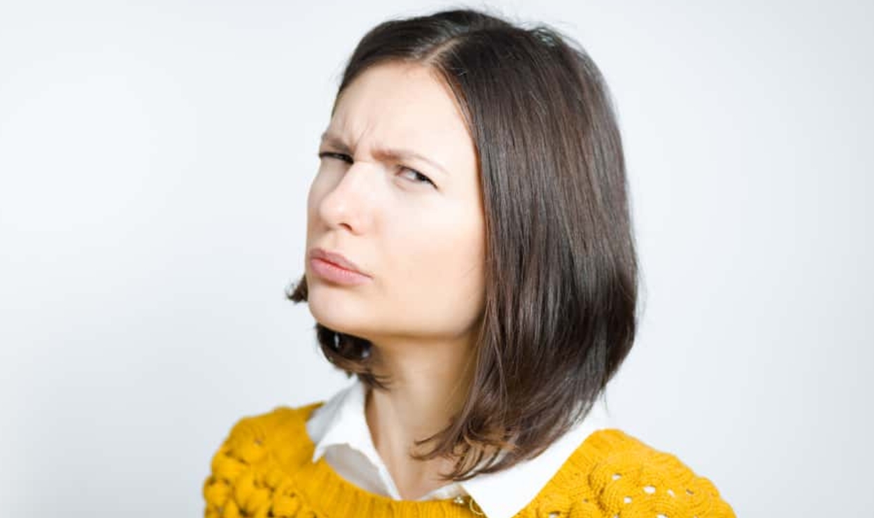 Beautiful Young Woman Looks Pessimistically, Shutterstock, 1037007178