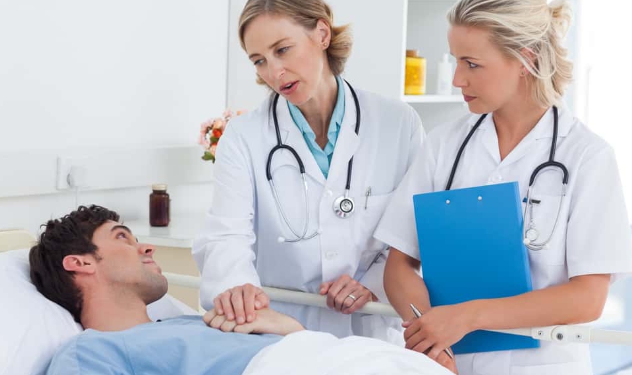 Doctors Talking To A Patient In Hospital, Shutterstock, 142932643