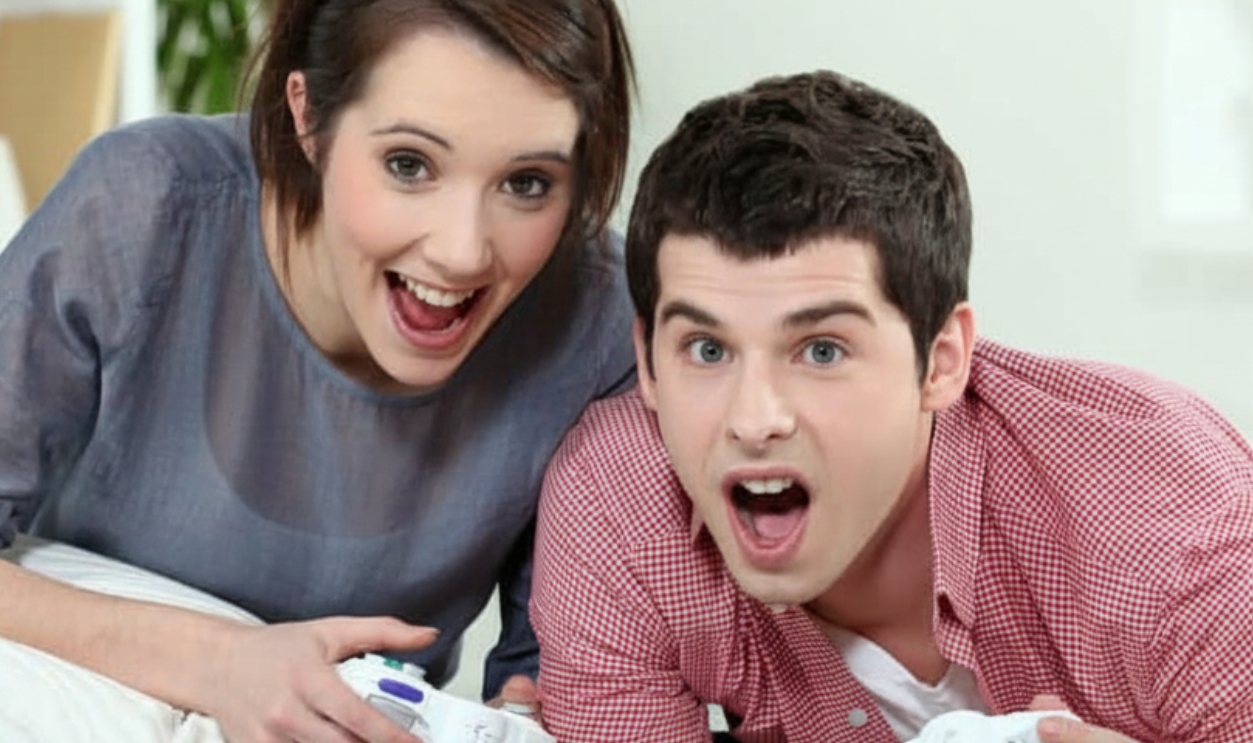 Young Couple Playing Video Games - Shutterstock 95612071