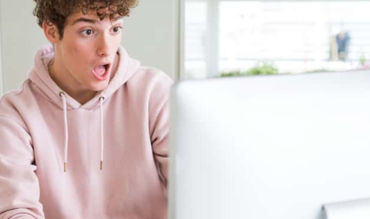 Young Student Man Using Computer Scared, Shutterstock, 1491020564