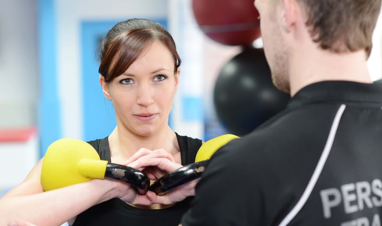 Young Woman Working Out With Kettle Bell, Shutterstock, 136133054