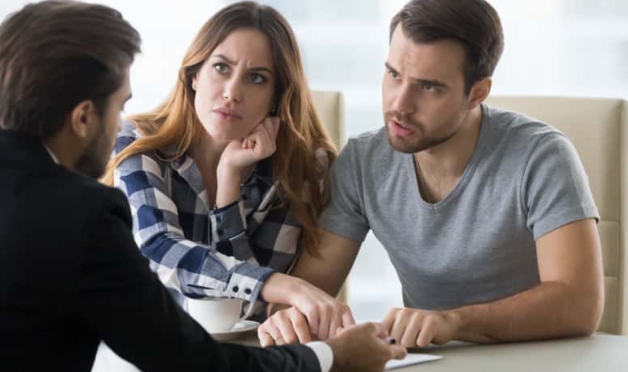 Angry Dissatisfied Couple Arguing Meeting Lawyer, Shutterstock, 1302585082