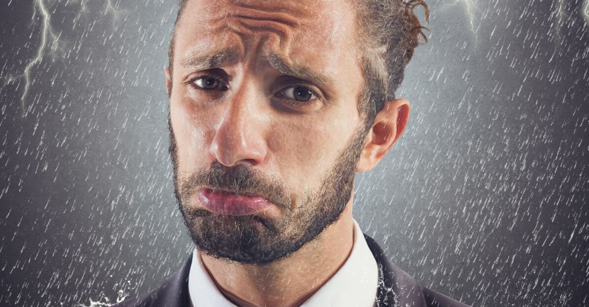 A frightened man with lightning