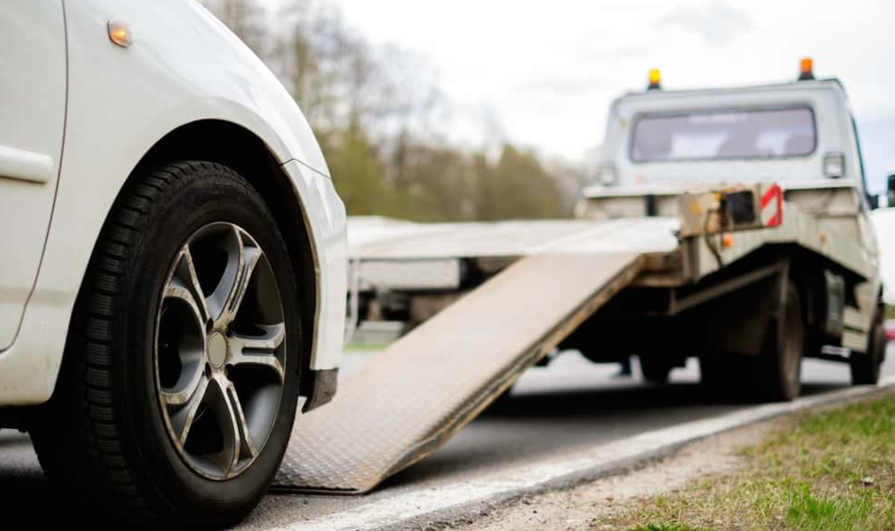 Loading Broken Car On A Tow Truck On A Roadside, Shutterstock, 275191160