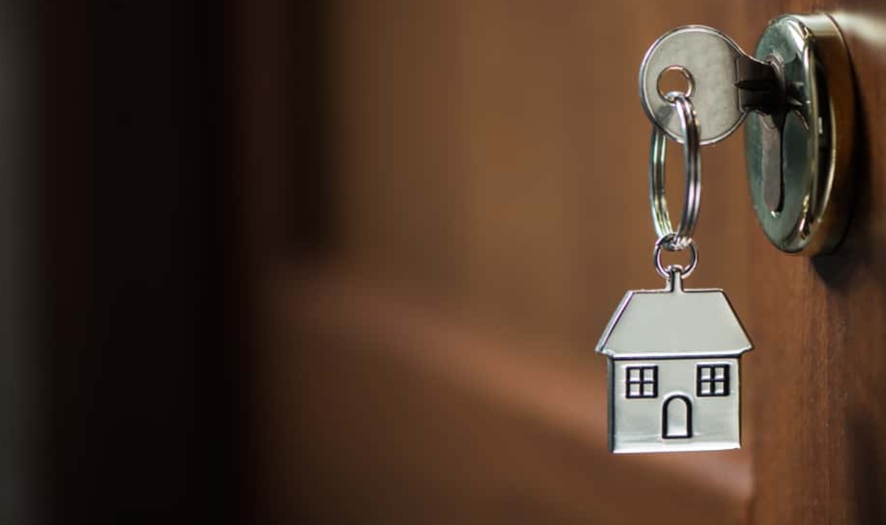 Silver House Key In A Door, Shutterstock, 787737604