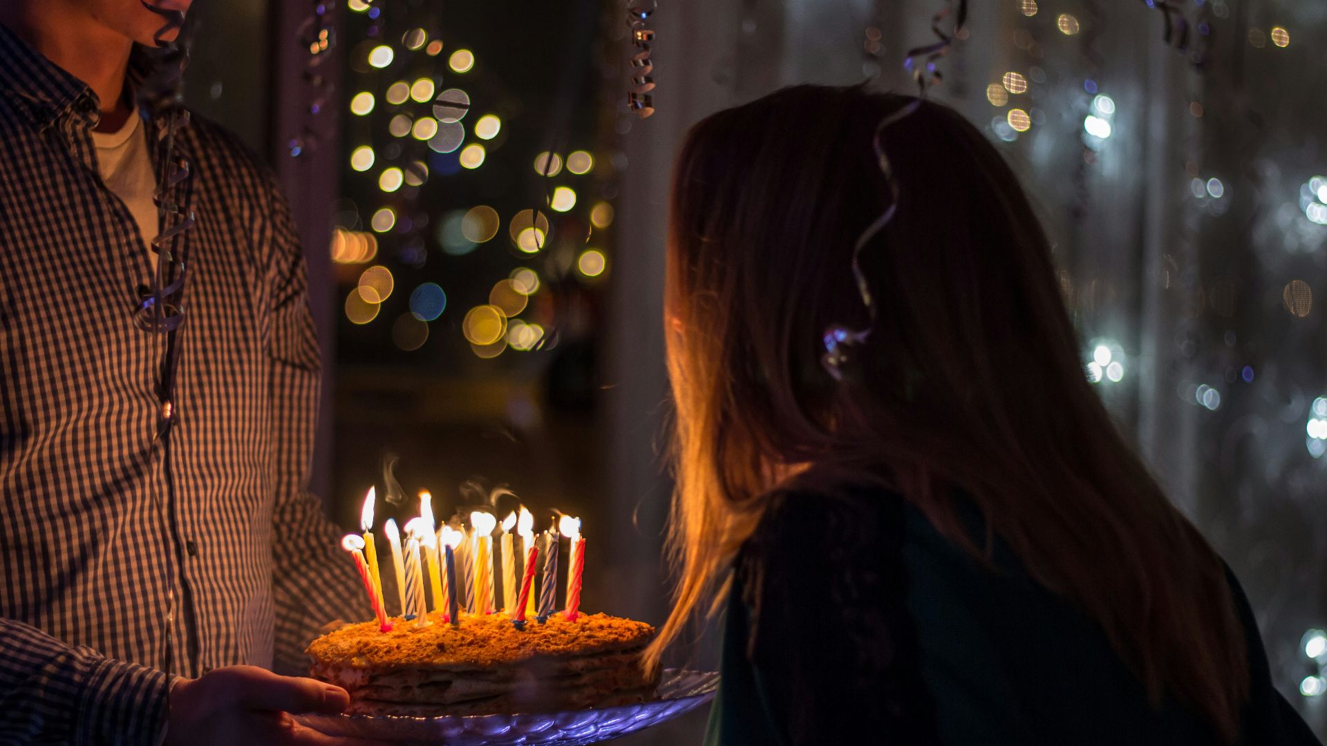 photo of birthday birth about to blow birthday candles