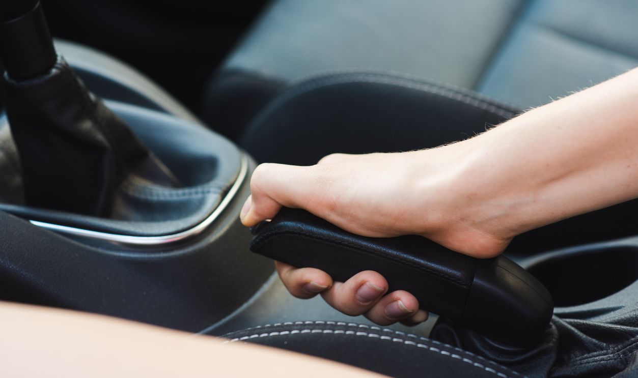Gettyimages - 1027819792, Picture of car hand brake close up - stock photo Female driver with black manual handheld