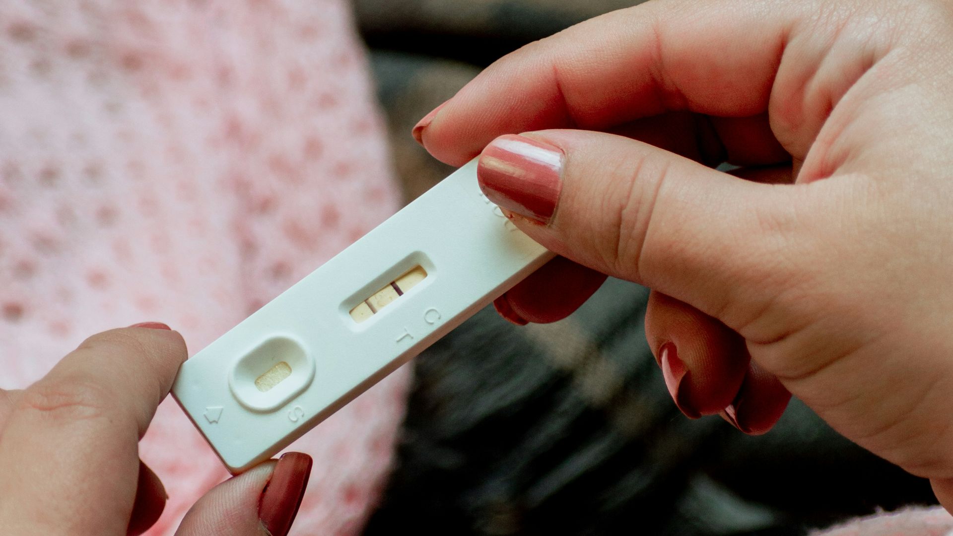 a person holding a cell phone in their hands