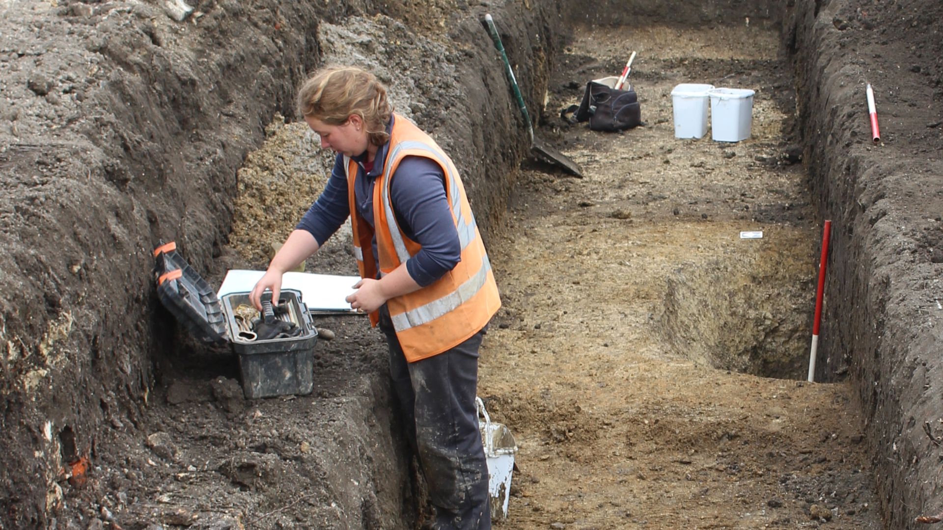 File:Archaeologist begining to record a feature in a trench.jpg