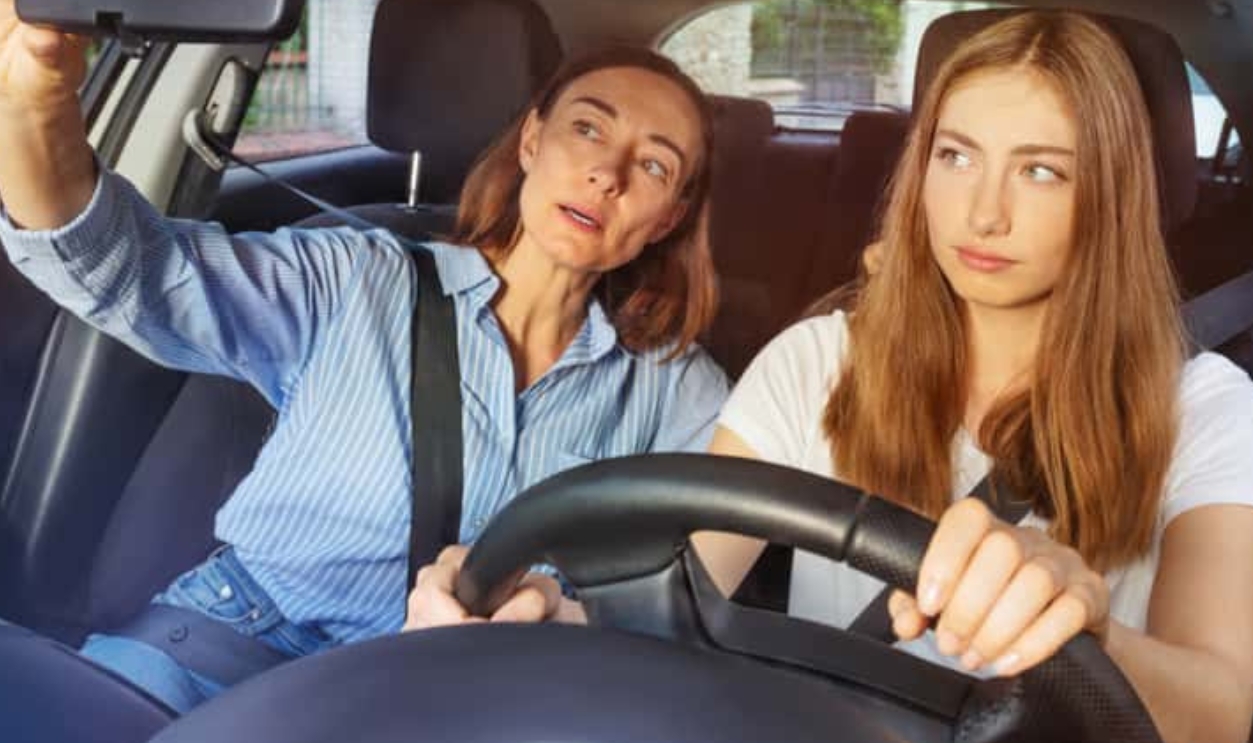 Girl And Her Mother During Driving Lesson, Shutterstock, 1280506495