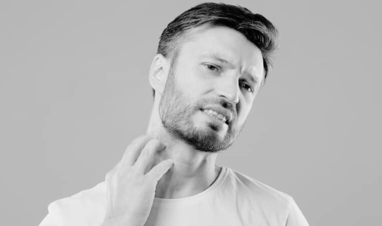 Middle Aged Bearded Man Scratching Highlighted With Red Neck, Shutterstock, 1879802755