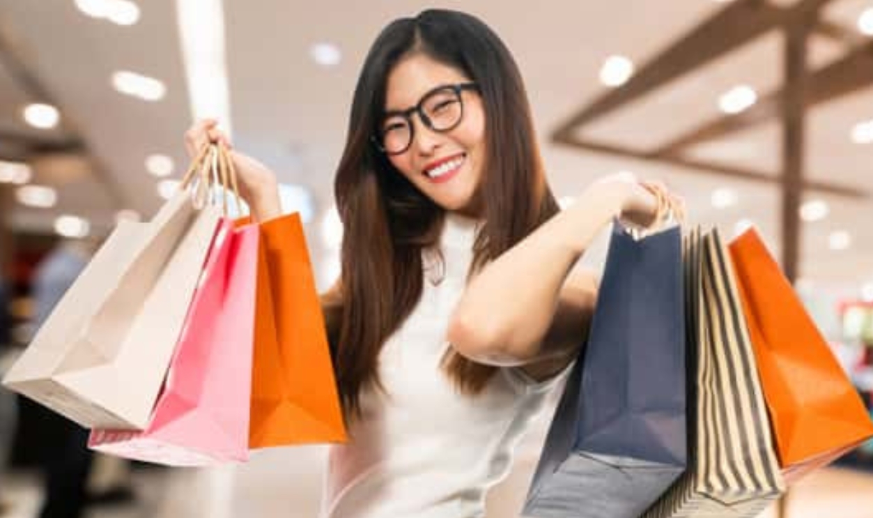 Young Cute Asian Woman Holding Shopping Bags, Shutterstock, 769147531