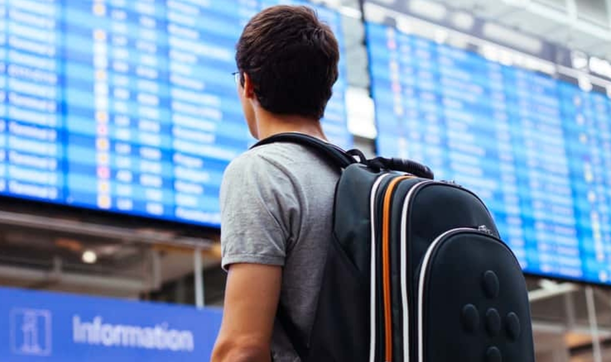 Young Man With Backpack In Airport, Shutterstock, 217435939