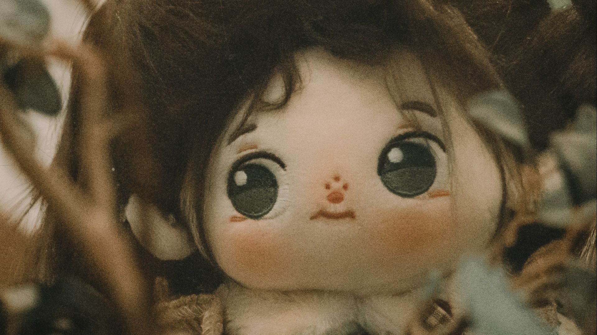 a close up of a doll in a tree