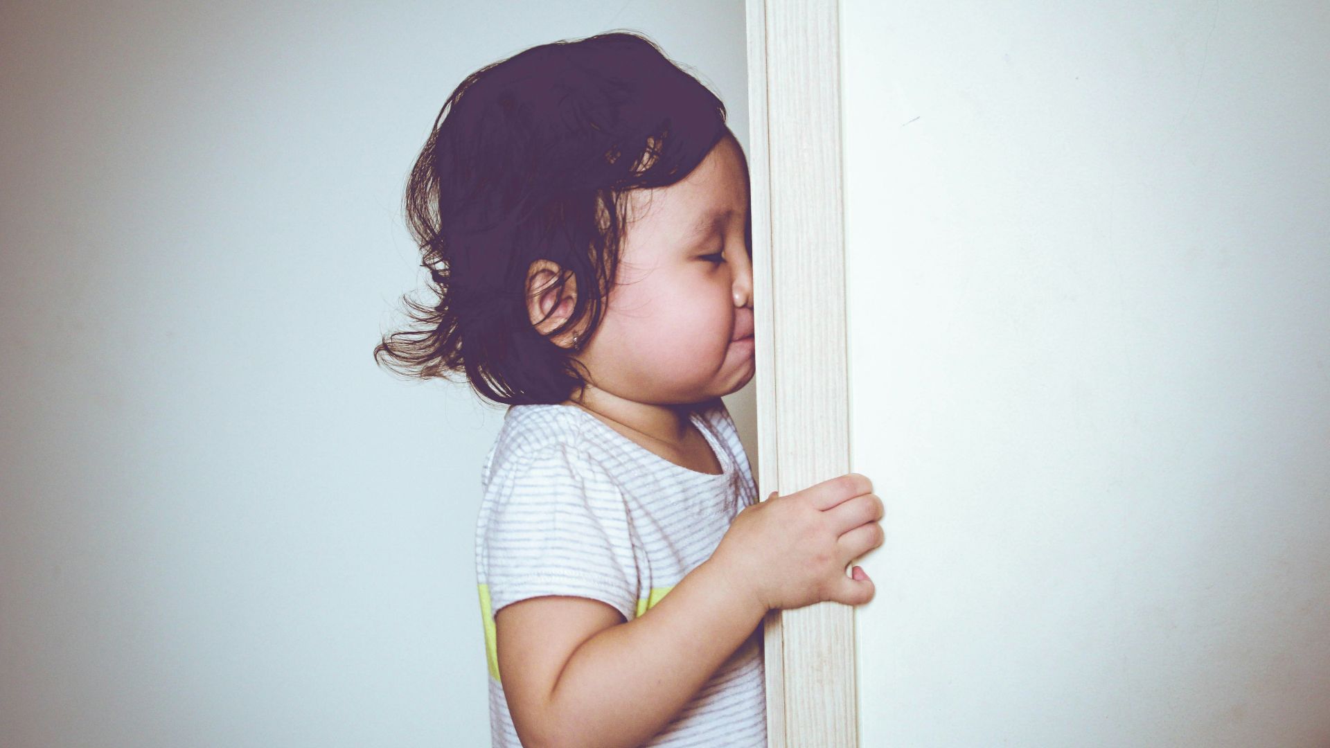 girl in white and blue stripe shirt