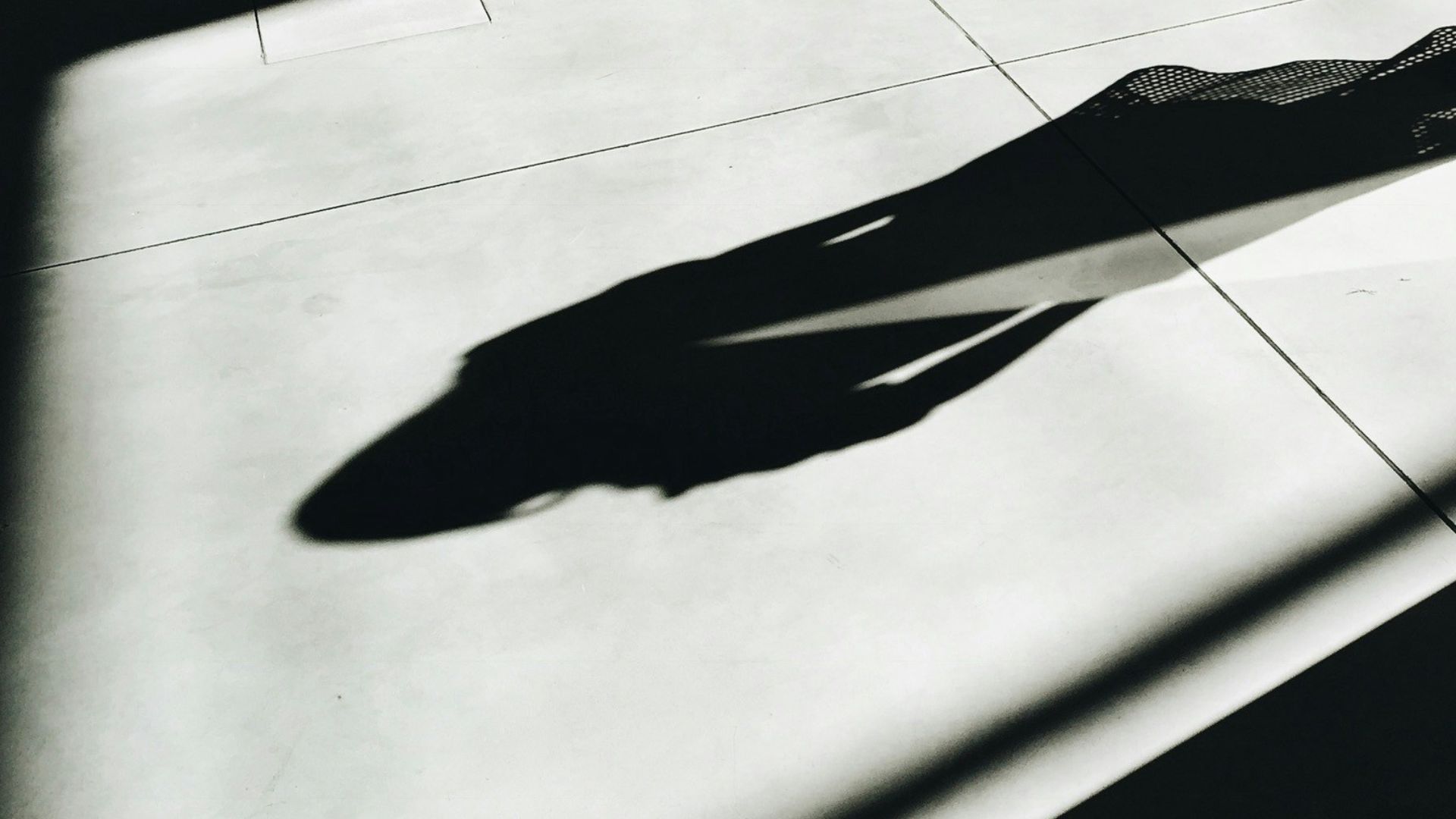 woman walking with shadow