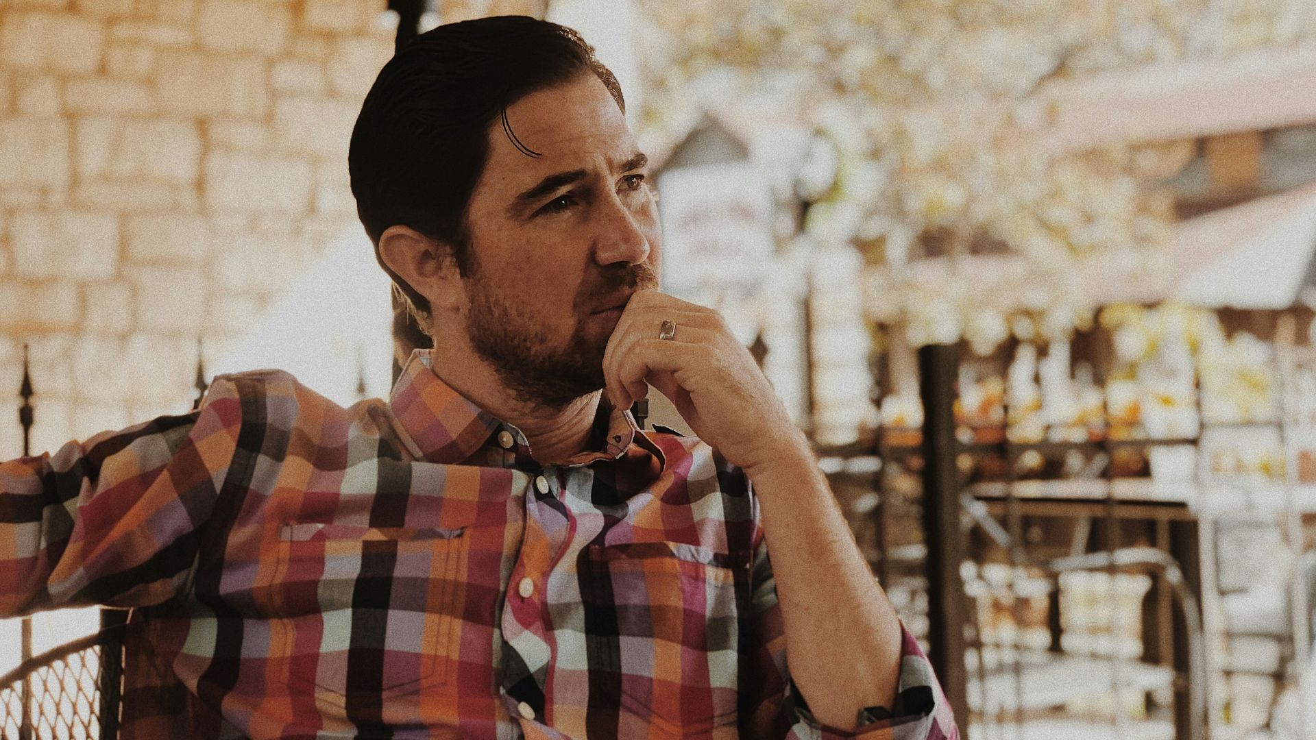 man in red and black plaid dress shirt