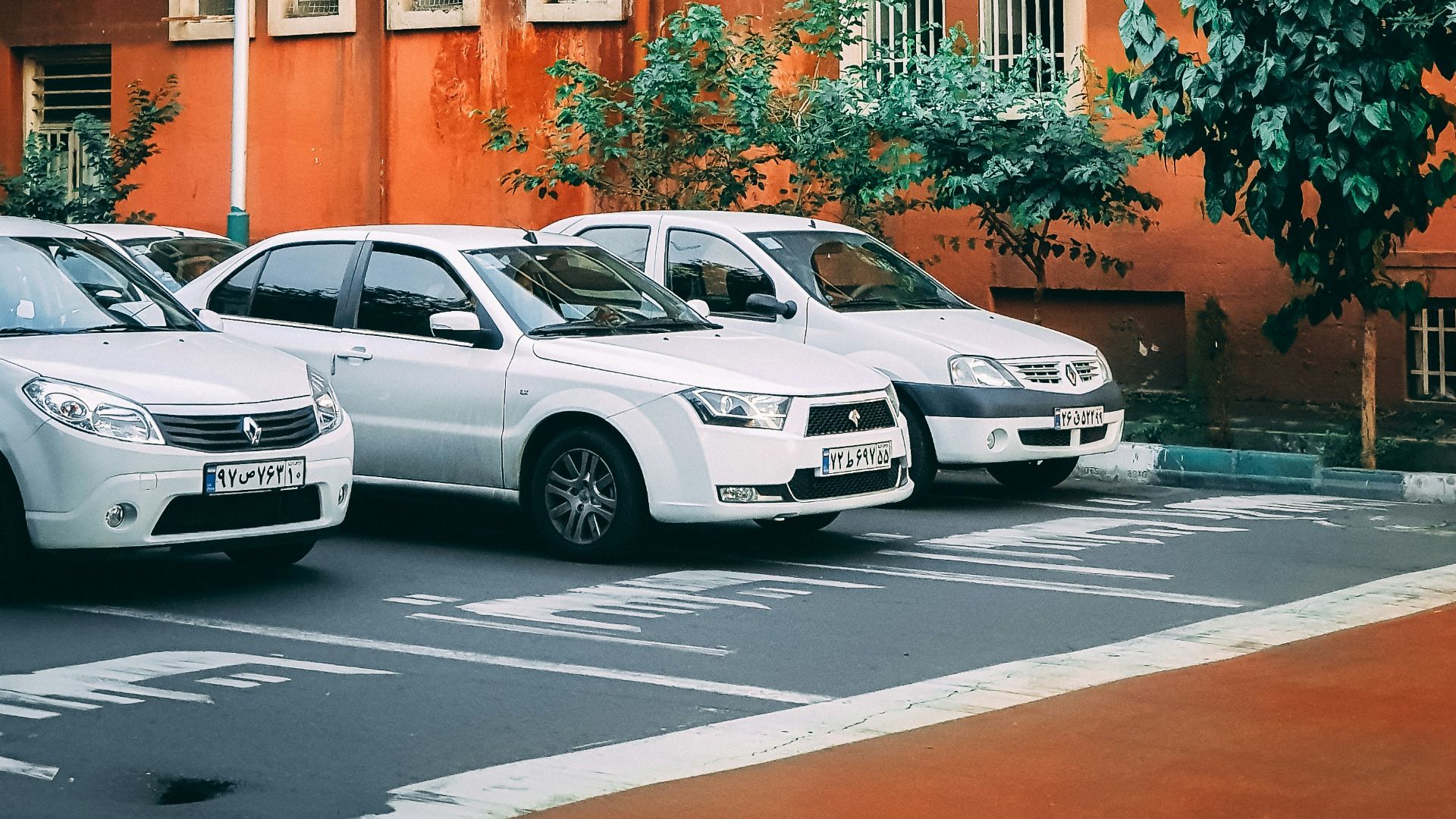 three cars on asphalt roas