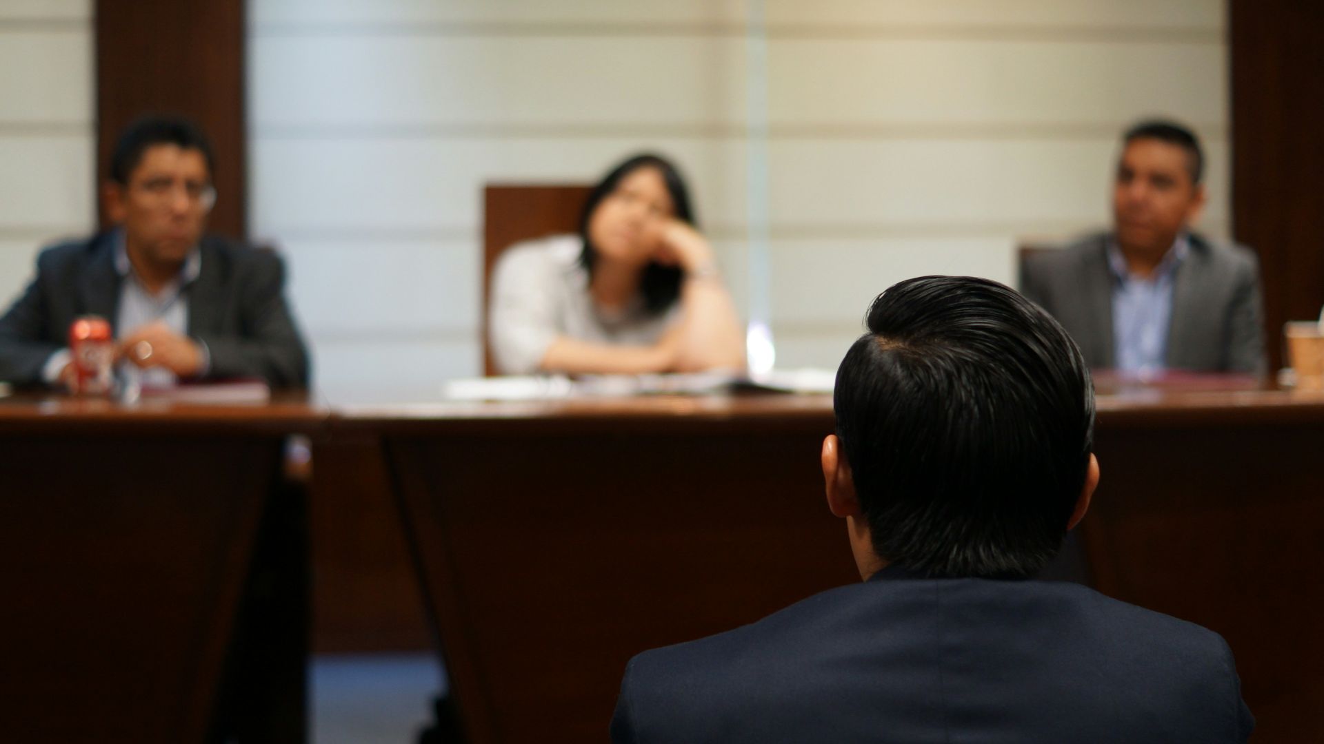 man in black shirt sitting beside woman in white shirt