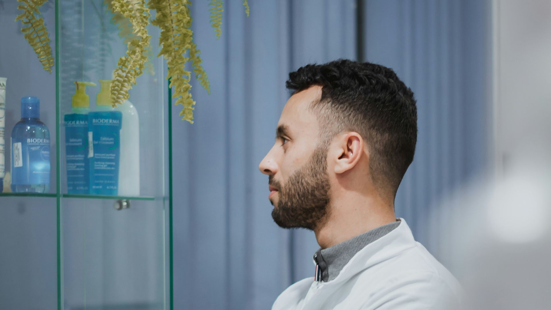 a man wearing a white coat