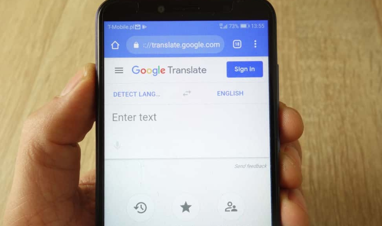 Hand Holding Smartphone With Google, Shutterstock, 1409800601