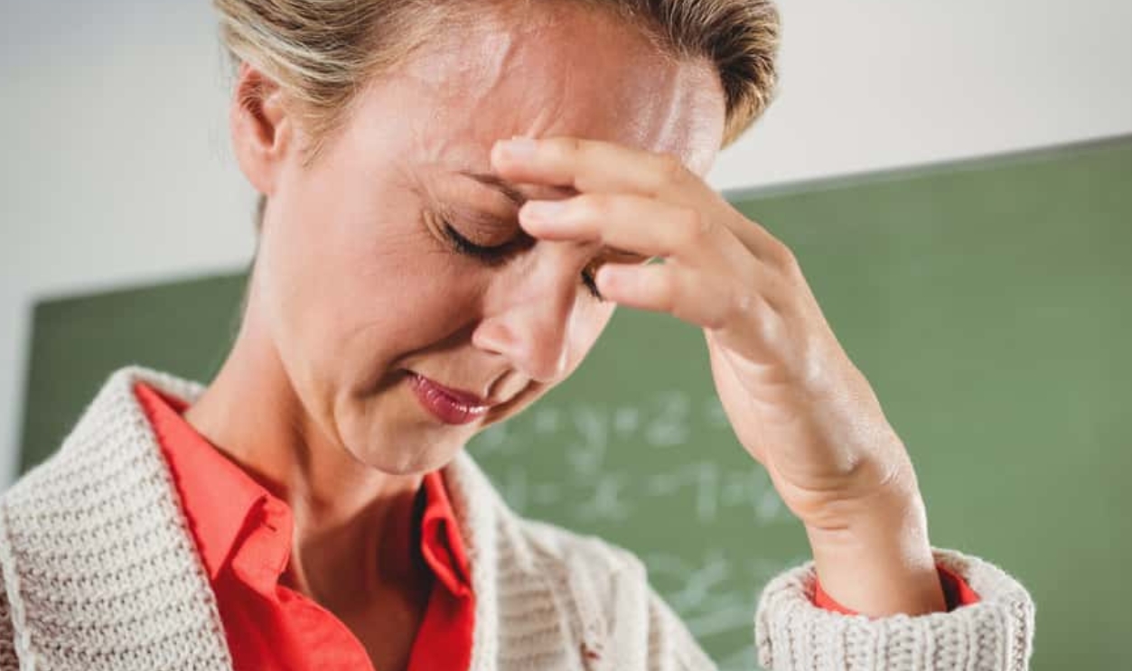Sad Teacher, Shutterstock, 447709705