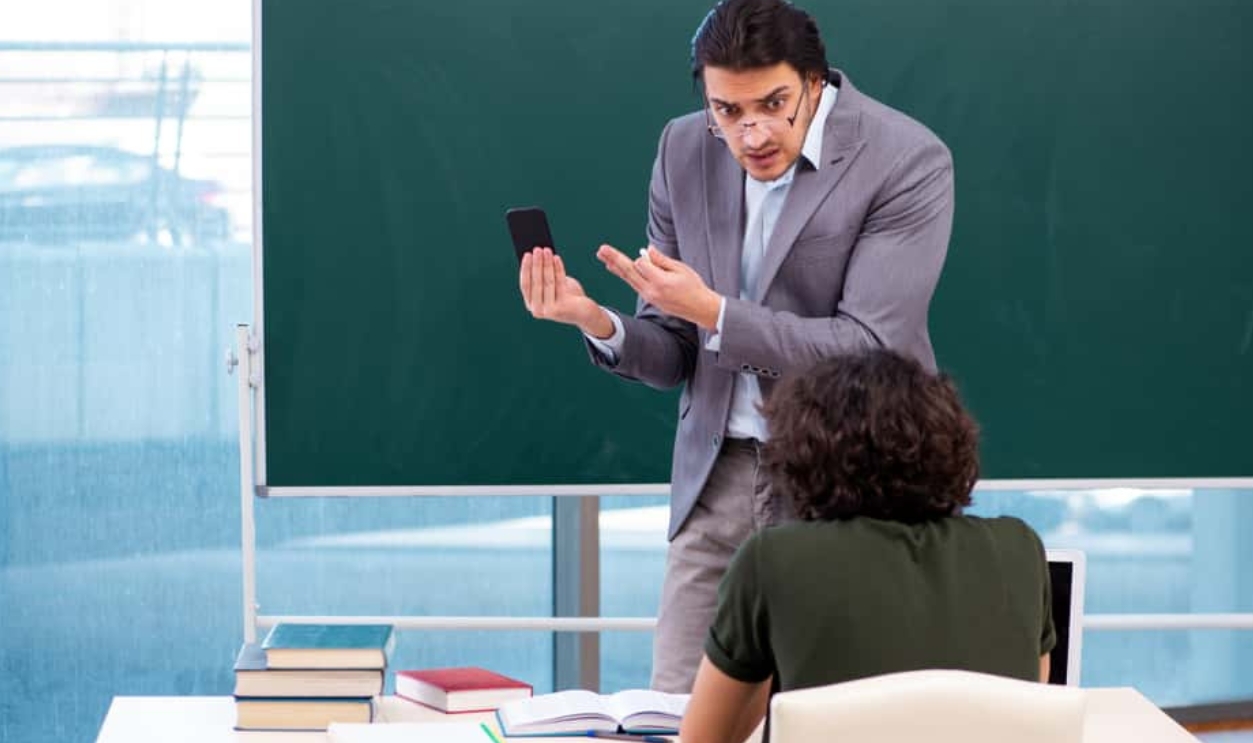 Young Teacher And Student In The Classroom , Shutterstock, 1385021189