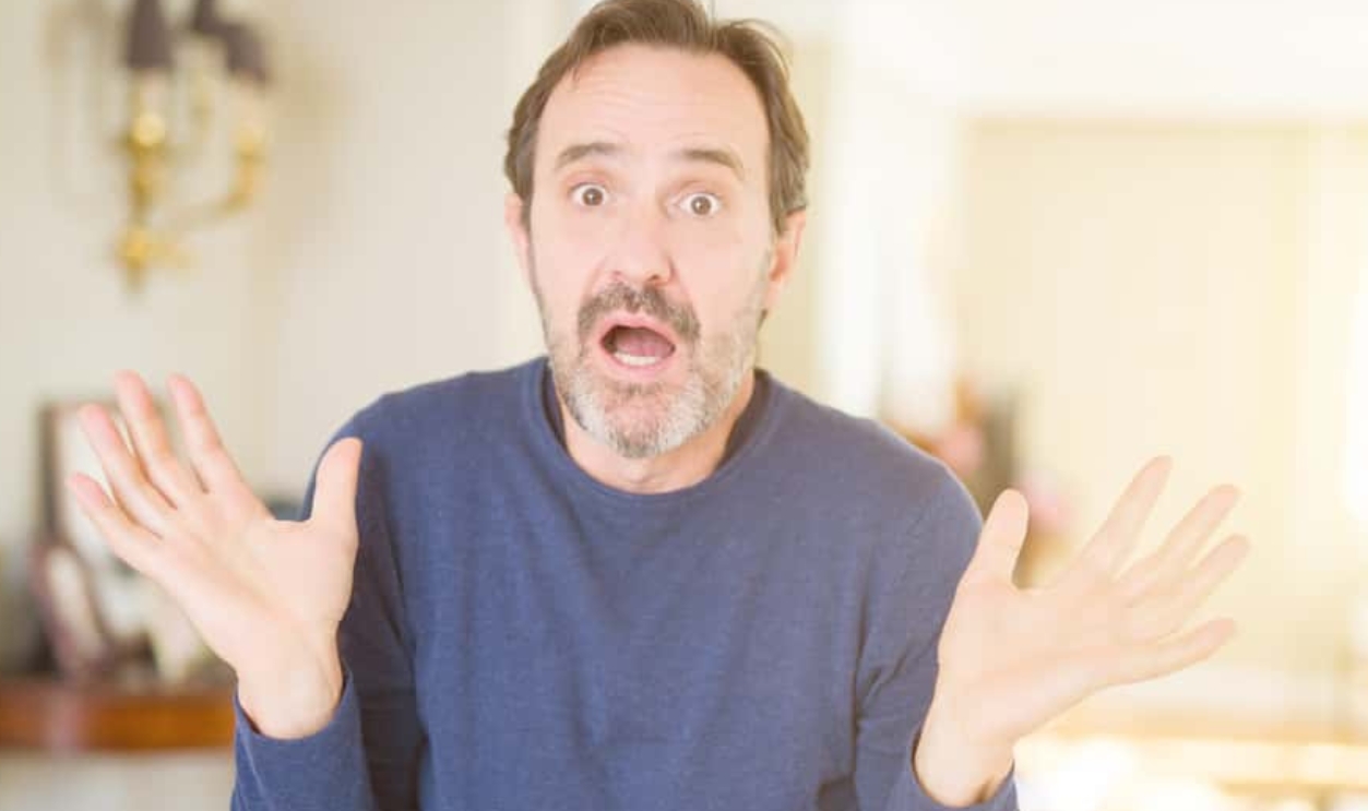 Handsome Middle Age Man At Home Clueless, Shutterstock, 1410452468