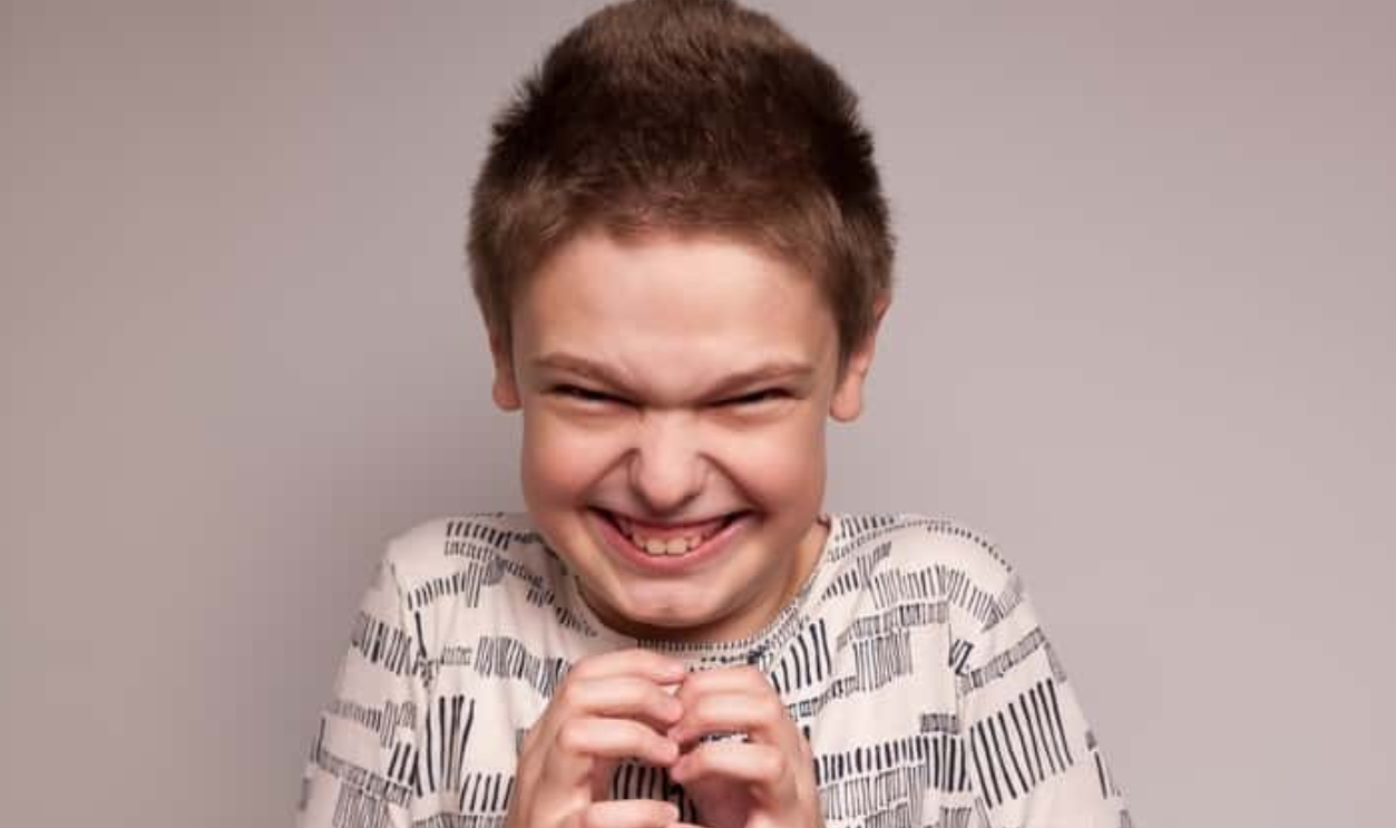 A Boy With A Sinister Mean Expression, Shutterstock, 2078356663