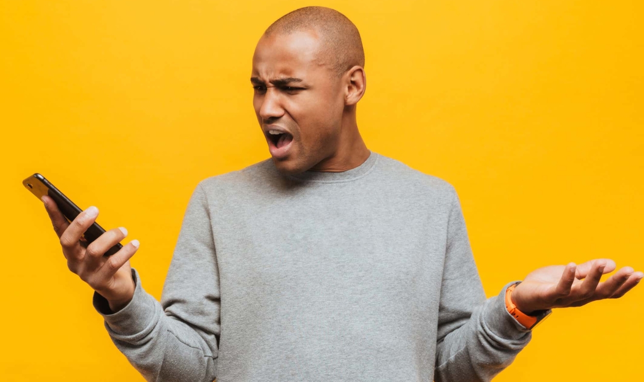 African Man Holding Mobile Phone, Shutterstock, 1630569730
