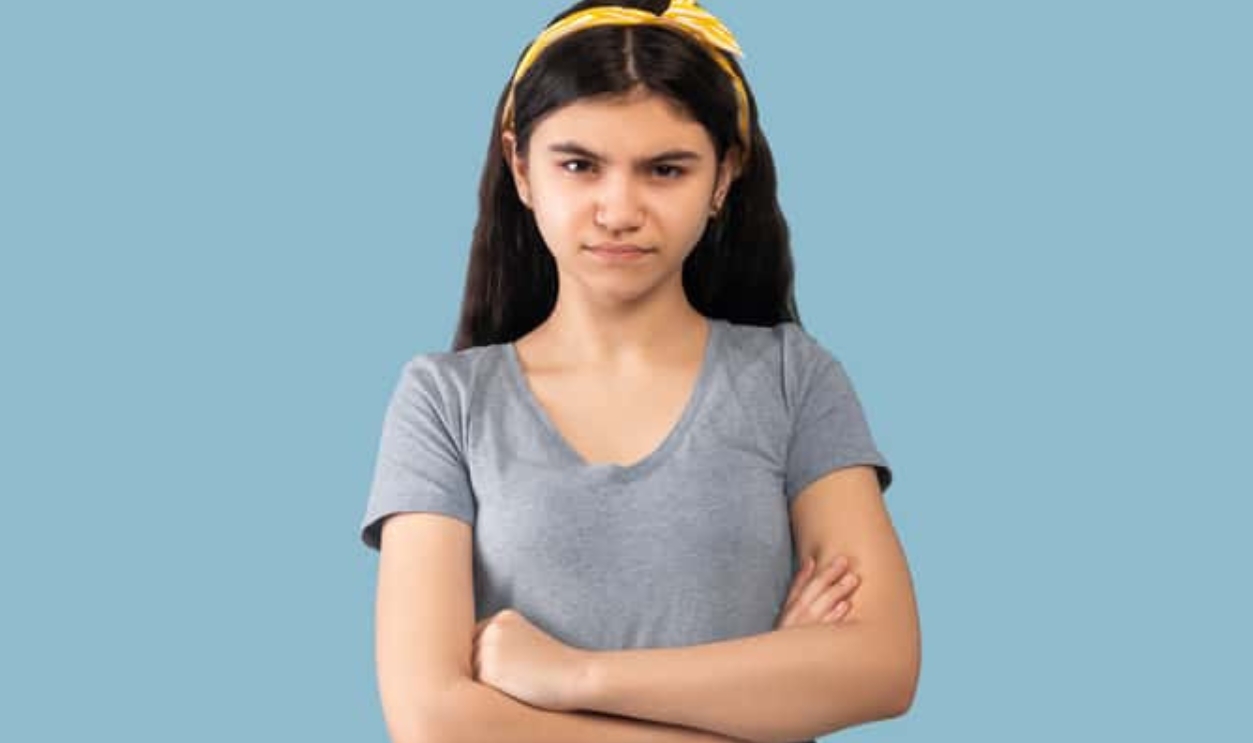 Angry Girl Adolescent Holding Hands Crossed, Shutterstock, 1964236159