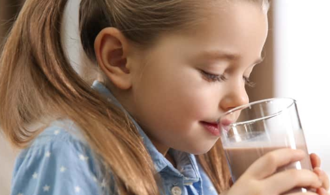 Child Drinking Tasty Chocolate Milk, Shutterstock, 1934591528