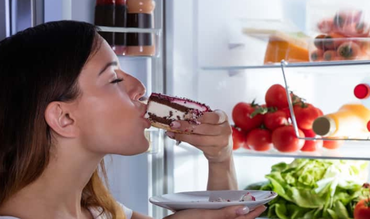 Open Refrigerator Eating Cake, Shutterstock, 566250442