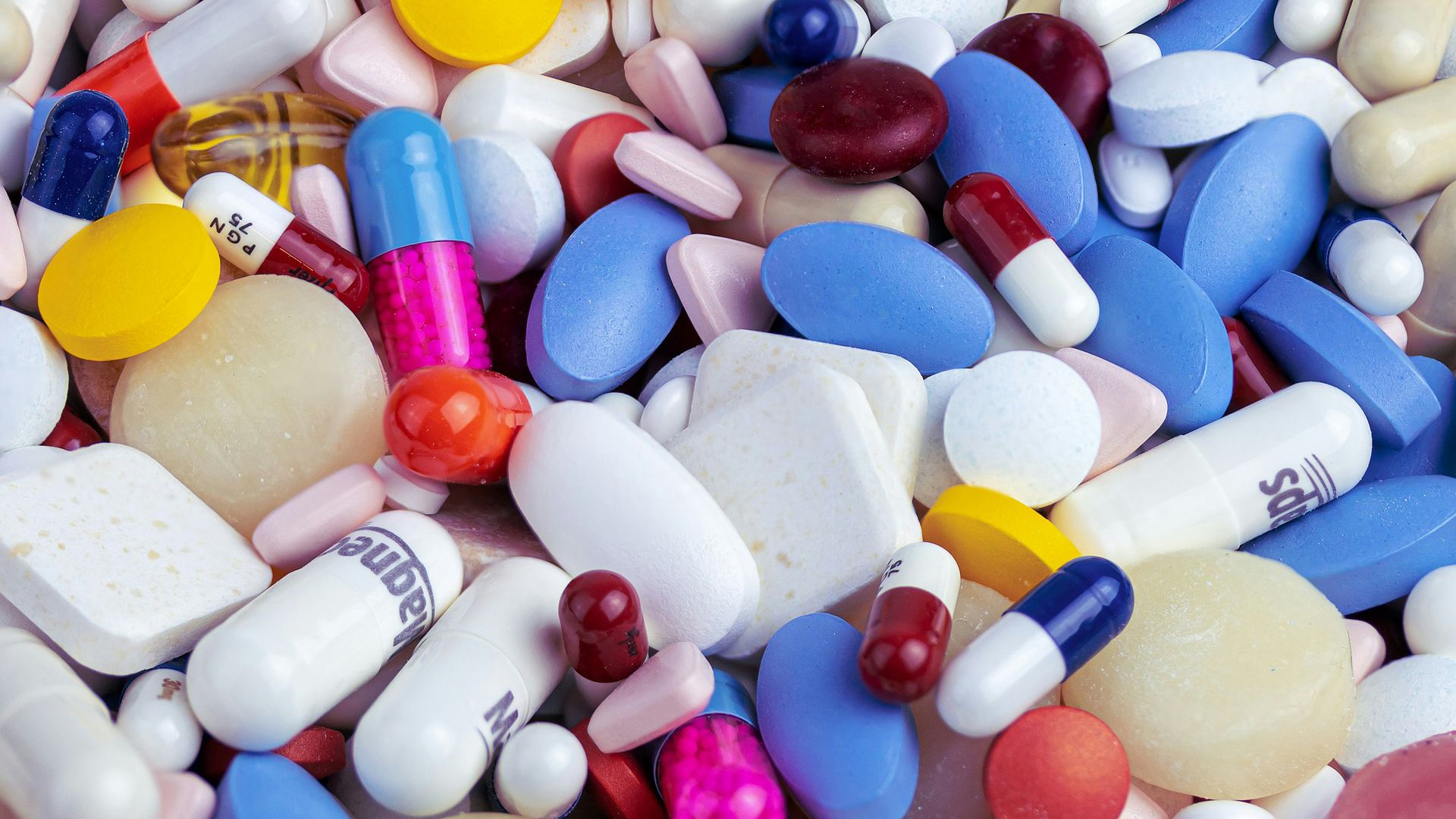 white blue and orange medication pill